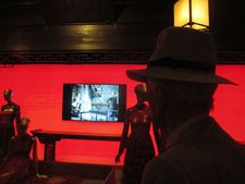 Gay Talese in silhouette looking at film clip edited by Wong Kar Wai